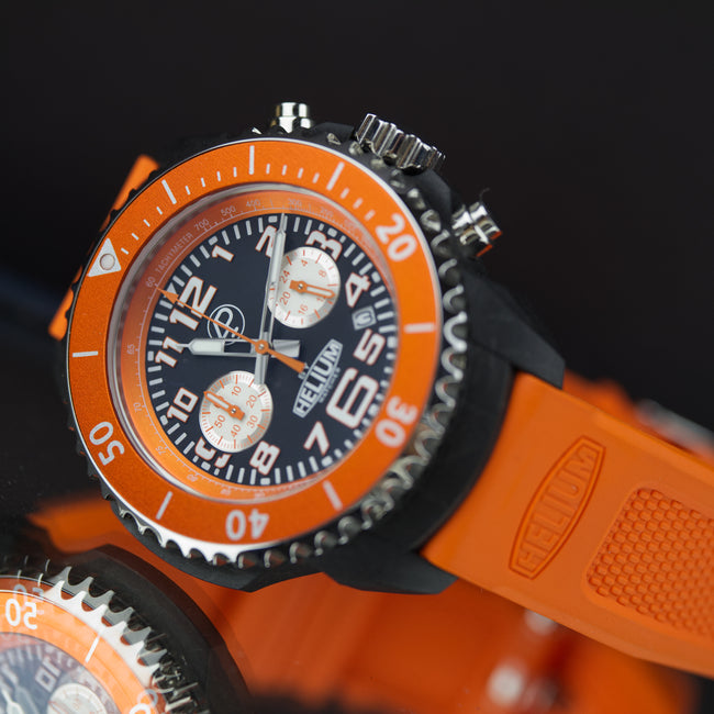 Orange watch with a detailed face on a black background